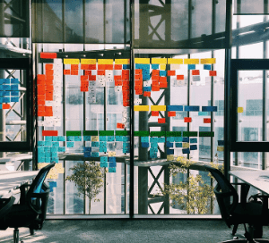 Small office space with post-it notes on the windows during a meeting