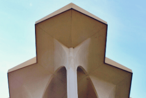 View of a beige building and blue sky