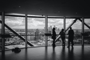 Black and white picture of people in a high rise office