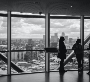 Black and white image of people in office