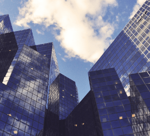 A picture of high sky buildings taken from the ground